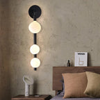 Mienel Lunara | Spherical Warm LED Wall Sconce Black Metal Frame